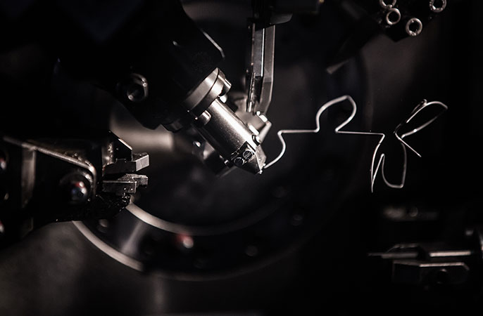 Machine is producing metal springs