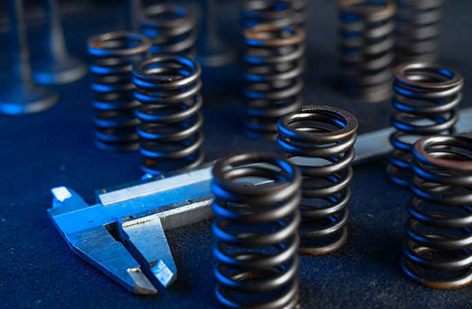 Measuring the length of compression springs with caliper